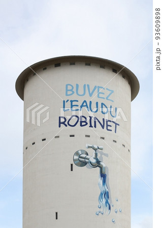 Water tower in Viriat with the slogan drink the tap water called buvez l'eau du robinet in french language, Bresse, France Water tower in Viriat with the slogan drink the tap water called buvez l'eau du robinet in french language, Bresse, France 93609898