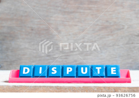 Tile alphabet letter with word dispute in red color rack on wood background 93626756