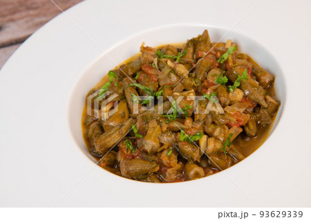 Bhindi masala or ladies finger fry served with indian roti chapati or Indian Flat bread Bhindi masala or ladies finger fry served with indian roti chapati or Indian Flat bread 93629339