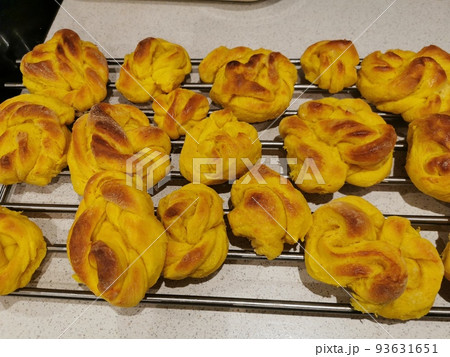 Saffron bun on kitchen background Saffron bun on kitchen background 93631651