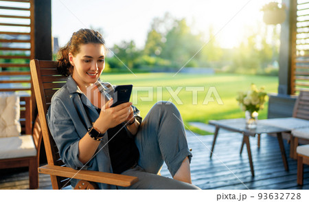 woman is using a phone woman is using a phone 93632728