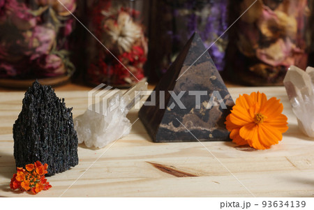 Quartz Crystals and Stone Pyramid With Flower. Relaxation and Meditation Decor Quartz Crystals and Stone Pyramid With Flower. Relaxation and Meditation Decor 93634139