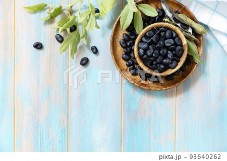 Raw organic vegetables. The concept of vegan or diet food. Fresh ripe black soy beans on a wooden table. View from above. Copy space. Raw organic vegetables. The concept of vegan or diet food. Fresh ripe black soy beans on a wooden table. View from above. Copy space. 93640262