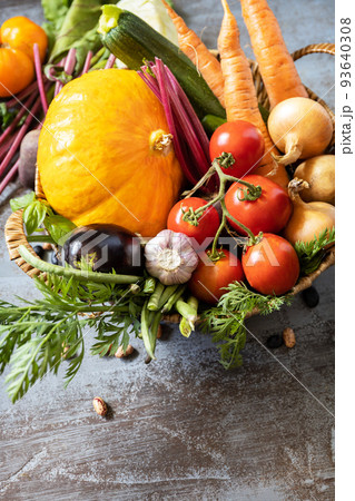 Raw organic vegetables. The concept of vegan or diet food. Vegetables for healthy cooking on a stone background. Copy space. 93640308