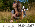 happy carefee young woman lies in grass in sunshining 93641367
