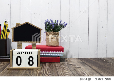 April 08 calendar date text on white wooden block on wooden desk. April 08 calendar date text on white wooden block on wooden desk. 93641966