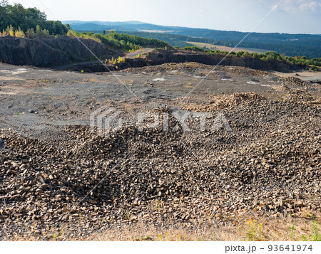 Basalt quarry. Marks of excavator operating in a rock quarry. 93641974