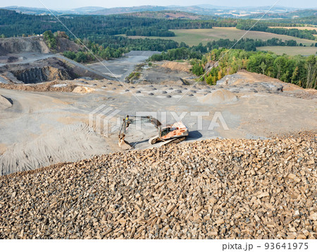 Heavy machinery in the clinkstone or phonolite mining quarry 93641975