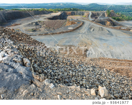 Basalt quarry. Marks of excavator operating in a rock quarry. 93641977