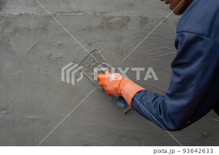 Cementitious trowel is used in the construction of buildings or rooms. 93642633