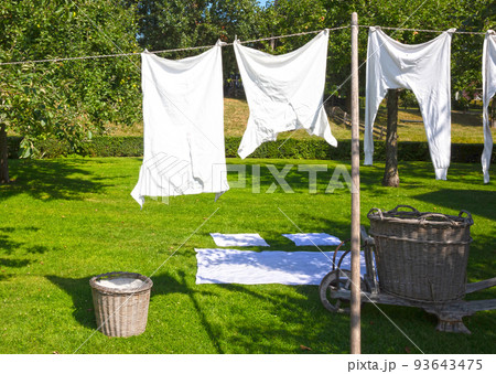 Antique clothes hanging outdoor in the nature to dry under the sun Antique clothes hanging outdoor in the nature to dry under the sun 93643475