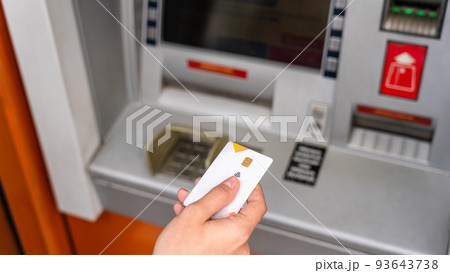 Atm cash machine. Money bank credit card holding hand. Withdraw money cash from atm. Money dollar, bank credit card. 93643738