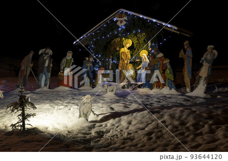 Christmas decoration outdoors covered with snow Christmas decoration outdoors covered with snow 93644120