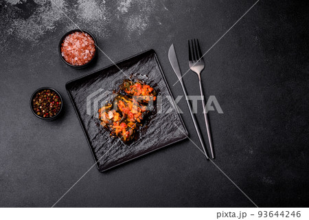 Dolma, stuffed grape leaves with rice and meat on a dark background 93644246