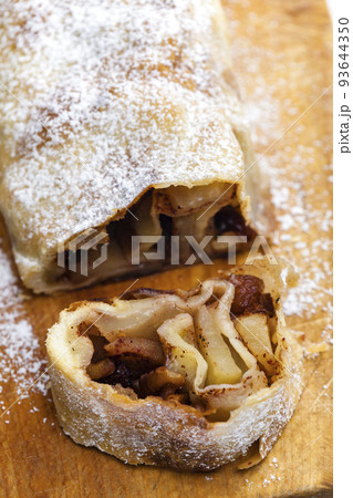 apple strudel on wooden board apple strudel on wooden board 93644350