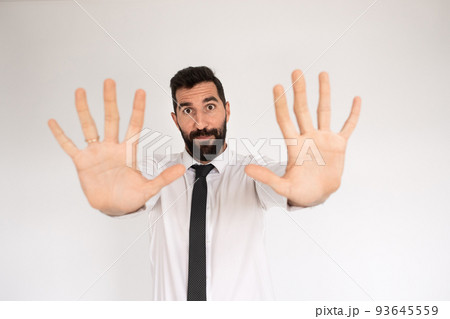 Handsome bearded man making stopping gesture 93645559