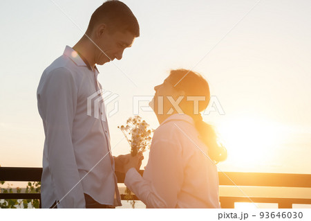 Couple with disabilities stands together at back sunset Couple with disabilities stands together at back sunset 93646030