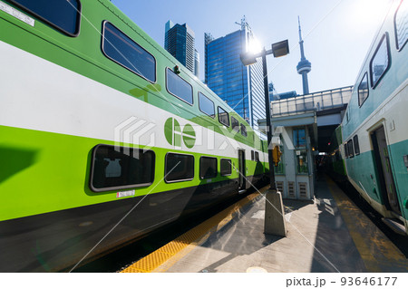 Toronto, ON, Canada - July 10 2021 : GO Transit Go Train arriving at Union Station platform. Toronto, ON, Canada - July 10 2021 : GO Transit Go Train arriving at Union Station platform. 93646177