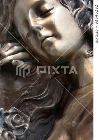 Vintage sculpture of sad woman in grief 93646292