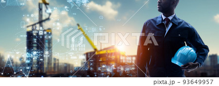 建設現場に立つエンジニアとデジタルデータイメージ　バナー・広告向け横長ビジュアル 93649957