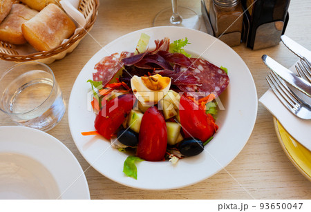 Portion of popular Catalan salad with sausages 93650047