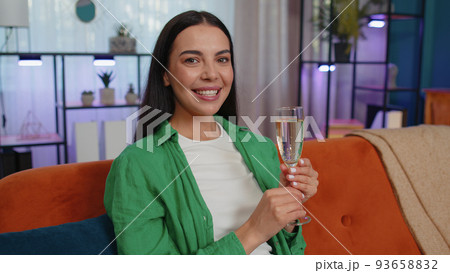 Happy woman drinking champagne celebrate success win, career grow up, lucky purchase of new house Happy woman drinking champagne celebrate success win, career grow up, lucky purchase of new house 93658832