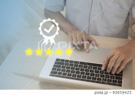 Businessman using laptop sign of leading service, 5 star quality assurance, warranty, standardization, ISO certification and standardization concept. 93659425