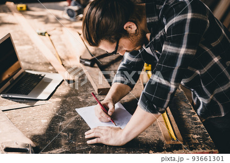 Builder engineer wood worker sketch design furniture home renovate projects at working desk. 93661301