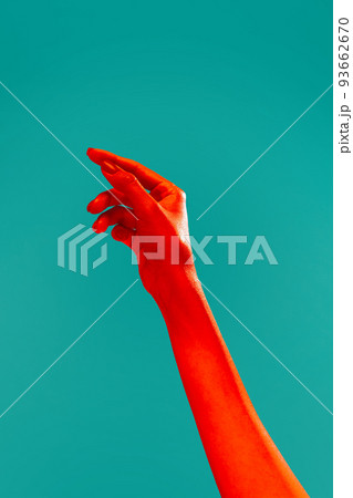 Female hand reaching up isolated on cyan color background in red neon light. Concept of relationship, community, care, support, symbolism, culture 93662670