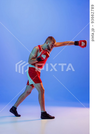 Right hook. Male boxer in red uniform and...の写真素材 [93662789] - PIXTA