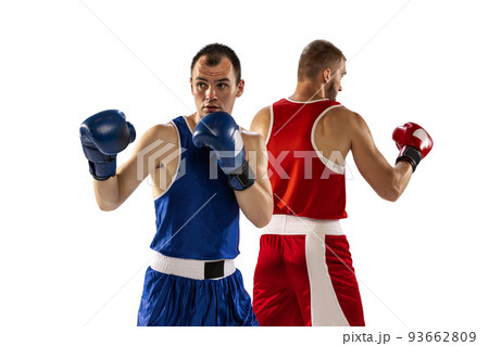 Young men, professional boxers in sports uniform boxing isolated on white studio background. Concept of sport, competition, training, energy 93662809