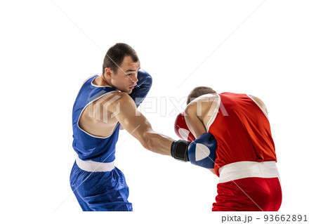 Sportive men, two professional boxer in sports uniform practicing punch isolated on white background. Concept of sport, competition, training, energy 93662891