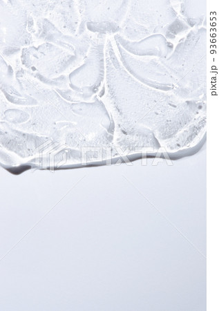 Transparent cosmetic texture. Skin serum or washing gel. Macrophotography. Copy space. 93663653