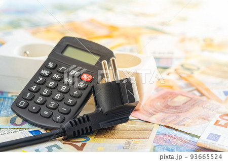 Electric plug, calculator and euro money. Concept of increasing electricity prices. Electric plug, calculator and euro money. Concept of increasing electricity prices. 93665524