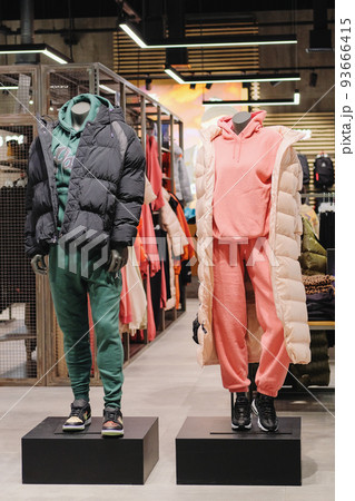 Mannequins in casual clothes stand in a clothing store. Mannequins in the big shopping shop. Mannequins in casual clothes stand in a clothing store. Mannequins in the big shopping shop. 93666415