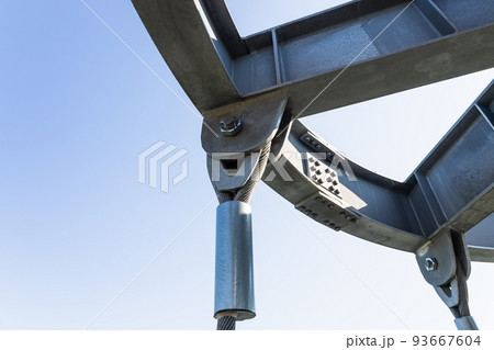 Massive industrial steel construction with bolts connecting steel beams, and metal rope Massive industrial steel construction with bolts connecting steel beams, and metal rope 93667604