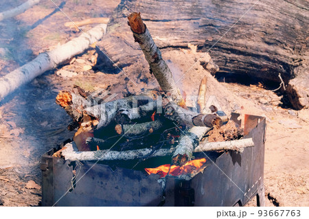 Flame from burning logs in fireplace. Wood fire prepared for grill on nature. Brazier with burning firewood. Picnic. Flame from burning logs in fireplace. Wood fire prepared for grill on nature. Brazier with burning firewood. Picnic. 93667763