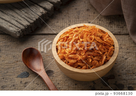 Shredded Dried Shrimp,asian condiment,orange small baby shrimp in wooden bowl background 93668130