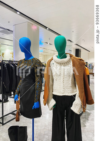Women clothing on mannequins in a store. Inside the modern large-scale clothing store, which is selling women's clothes. Women clothing on mannequins in a store. Inside the modern large-scale clothing store, which is selling women's clothes. 93669368