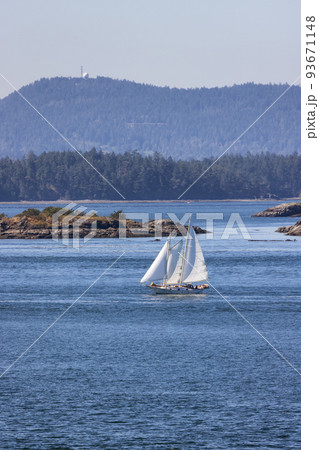 Sailboat in Canadian Landscape by the ocean and mountains Sailboat in Canadian Landscape by the ocean and mountains 93671148
