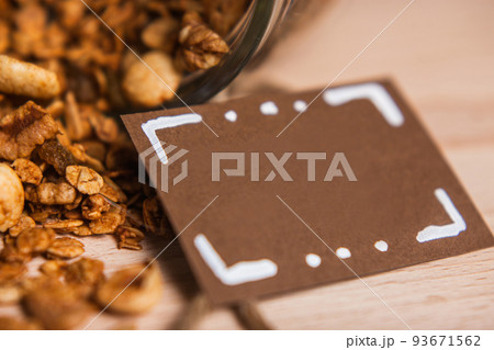 Tasty spilled homemade granola on wooden table 93671562