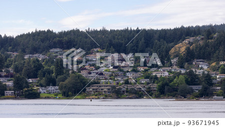 Homes by the water, surrounded by tees and mountains. Summer Season. 93671945