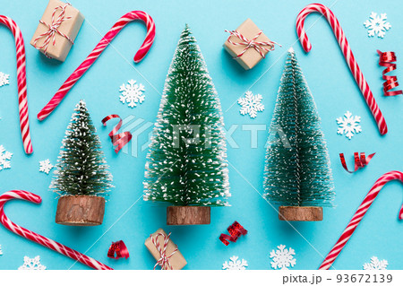Flat lay composition with christmas trees on color background. Top view with copy space 93672139