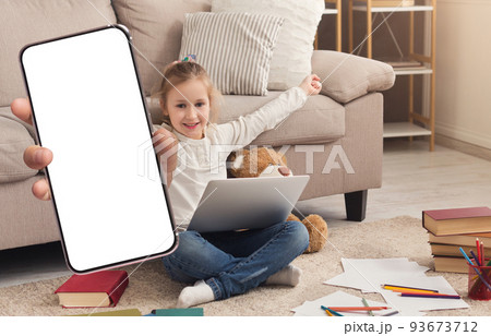 Educational App. Cheerful Preteen Girl Showing Blank Smartphone While Study At Home 93673712