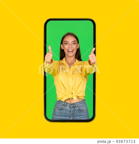 Lady In Smartphone Screen Gesturing Thumbs Up Over Yellow Background 93673713