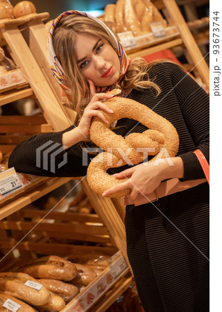 Pretty woman in the bread depatment 93673744