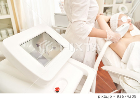 Laser hair removal treatment. Clinic skin care procedure. Medical dermatology Laser hair removal treatment. Clinic skin care procedure. Medical dermatology 93674209