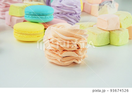Marshmallows, macaroons, and zephyrs. Traditional colored sweet desserts for the holiday, copy space. 93674526
