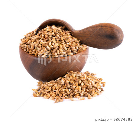 Utsho suneli seeds in wooden bowl and spoon, isolated on white background. Trigonella caerulea or blue fenugreek. 93674595