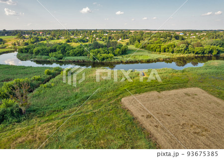 Drone view over summer sunset river Ros landscape, Ukraine. Drone view over summer sunset river Ros landscape, Ukraine. 93675385